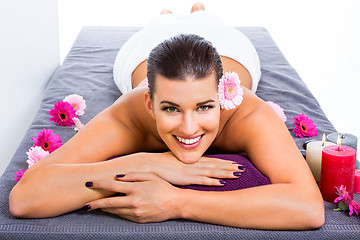 Image showing Beautiful woman enjoying a hot stone massage