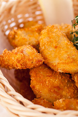 Image showing Crumbed chicken nuggets in a basket