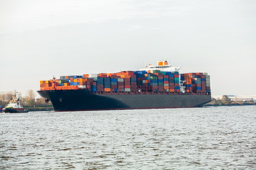 Image showing Fully laden container ship in port