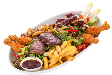 Image showing Platter of mixed meats, salad and French fries