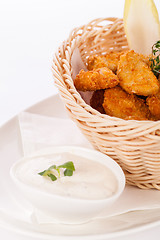 Image showing Crumbed chicken nuggets in a basket