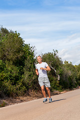 Image showing athletic man runner jogging in nature outdoor