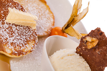 Image showing tasty sweet pancakes with vanilla icecream and topping