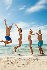 Image showing young happy friends havin fun on the beach