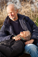 Image showing happy senior couple relaxing together in the sunshine