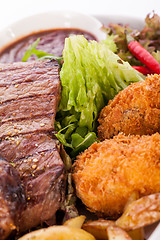 Image showing Platter of mixed meats, salad and French fries