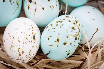 Image showing Three natural blue Easter eggs in a basket