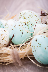 Image showing Three natural blue Easter eggs in a basket