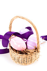 Image showing Straw basket with traditional Easter eggs