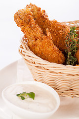 Image showing Crisp crunchy golden chicken legs and wings