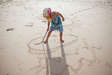 Image showing Young girl playing on beach