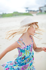 Image showing Cute young girl having fun at beach