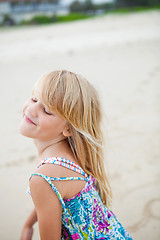 Image showing Happy cute young girl at beach