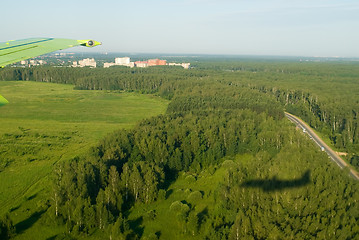 Image showing Shadow of plane on forest background