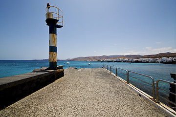 Image showing lighthouse and pier boat in the blue sky   arrecife teguise