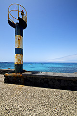 Image showing lighthouse and pier boat in the lanzarote spain