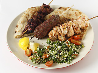 Image showing Barbecue kebab plate with tabouleh