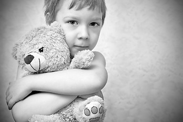 Image showing Young boy with teddy bear, portrait