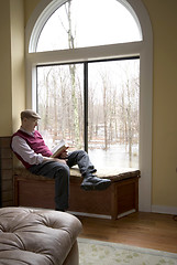 Image showing reading book at suburban house