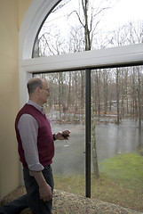 Image showing looking at flooded backyard