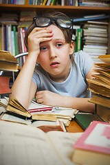 Image showing Girl tired of learning lessons