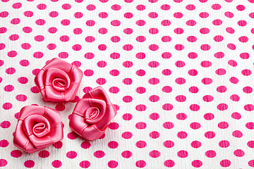 Image showing polka dot paper and pink decorative roses