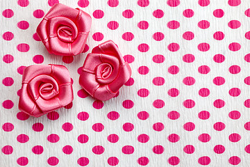 Image showing polka dot paper and pink decorative roses