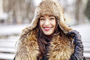 Image showing Girl smiling in fur hat and coat