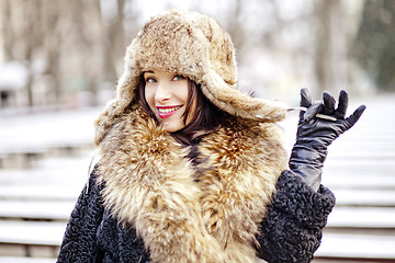 Image showing Joyfull russian woman in fur hat and coat