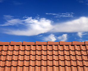 Image showing Roof tiles and sky with clouds