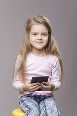 Image showing Portrait girl with a small mirror in hands of