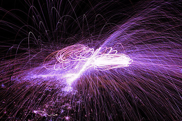 Image showing Showers of hot glowing sparks