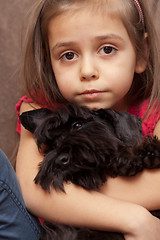 Image showing Portrait of a little girl with dog