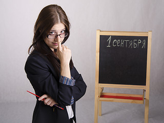 Image showing Portrait of teacher spectacles on his nose and Board