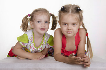 Image showing two girls lay leaning on his hands