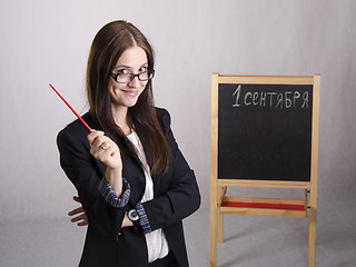 Image showing Portrait of teacher, with pointer and a Board