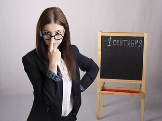 Image showing Portrait of teacher spectacles on his nose and Board