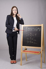 Image showing Portrait of teacher with a pointer at Board
