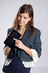 Image showing Young long-haired woman and tablet