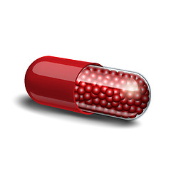 Image showing Medical red capsule with granules