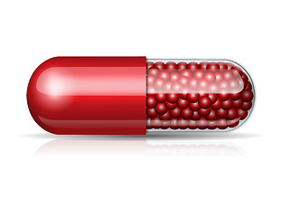 Image showing Medical red capsule with granules