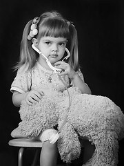 Image showing Girl playing in doctor with a Teddy bear