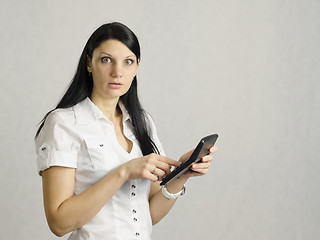 Image showing girl is very upset by counting on the calculator