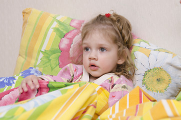 Image showing Two-year-old girl is in bed under the blanket