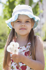 Image showing Portrait of a girl with dandelions