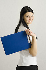 Image showing Business girl keeps folder with documents
