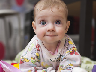 Image showing six-month baby with a fun look at home