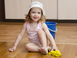Image showing Little girl wash rag floors