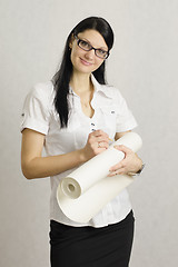 Image showing girl wrote in pencil on the roll of paper