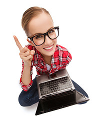 Image showing smiling teenage girl in eyeglasses with laptop